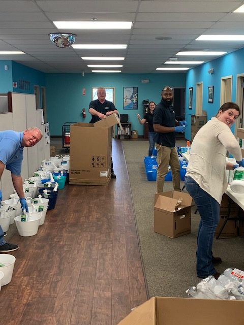 CSC ServiceWorks employees packing boxes