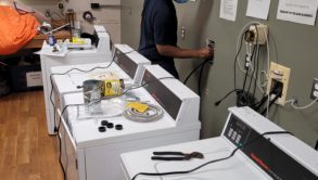 man installing wash machines