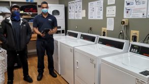 2 man installing wash machines